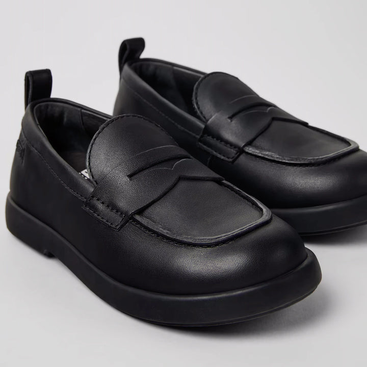 Duet black leather shoes with rubber outsoles for children.