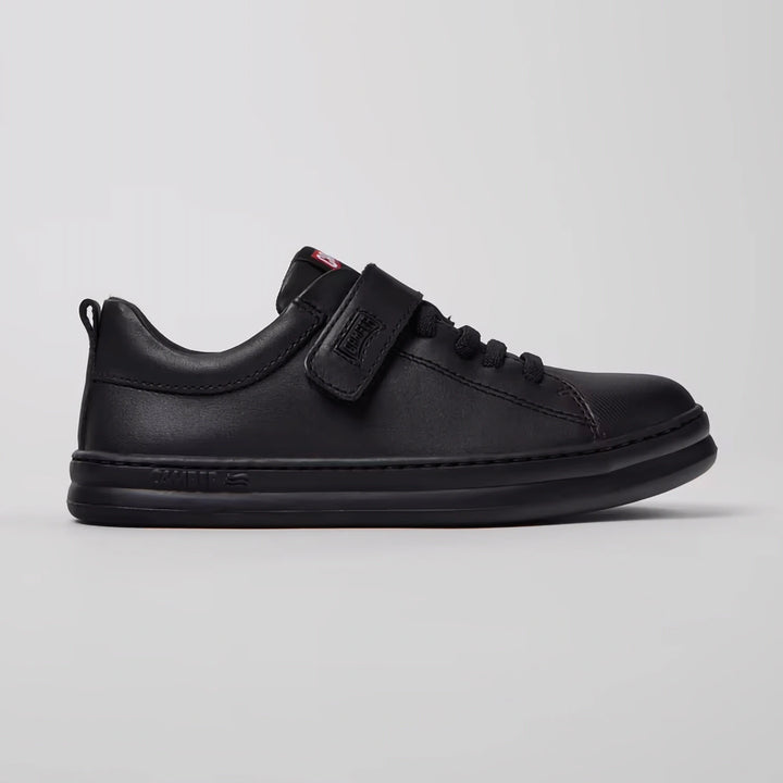 Side view of trendy black kids' camper sneakers 