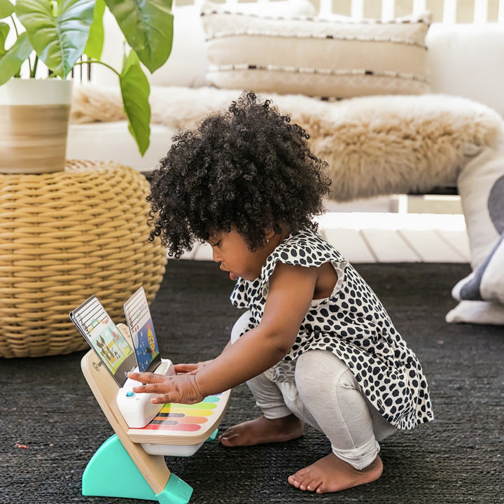 wooden toy piano for toddlers with light-up keys and sheet music