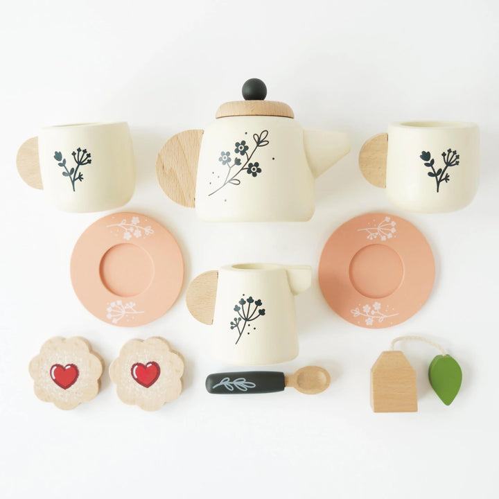 Eco-friendly child's tea service with sugar biscuits.