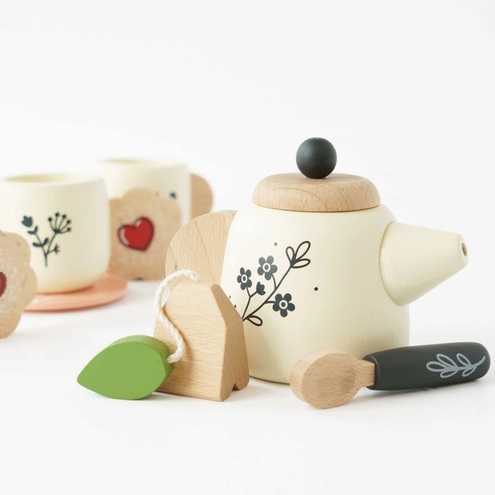 Lightweight, portable wooden tea set for toddlers.