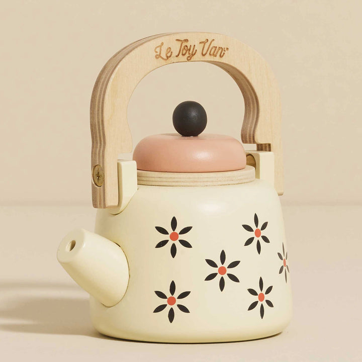 Cream-coloured vintage kettle for pretend play.