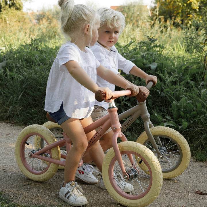 Adorable Little Dutch Balance Bike in Matt Pink: Perfect for toddlers learning to ride.