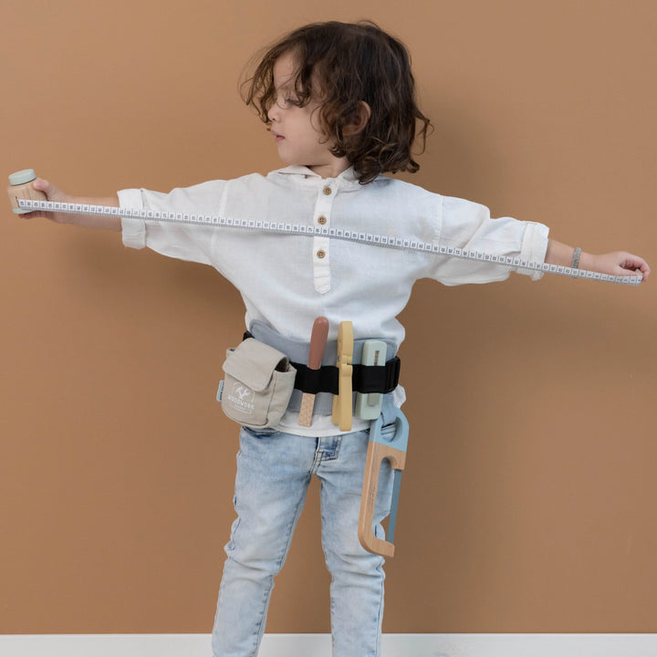 Child wearing Little Dutch Tool Belt during pretend play.