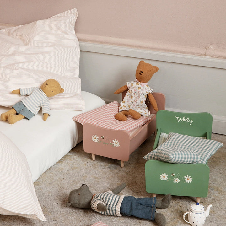 Wooden bed for Teddy Dad in dusty green with floral details.