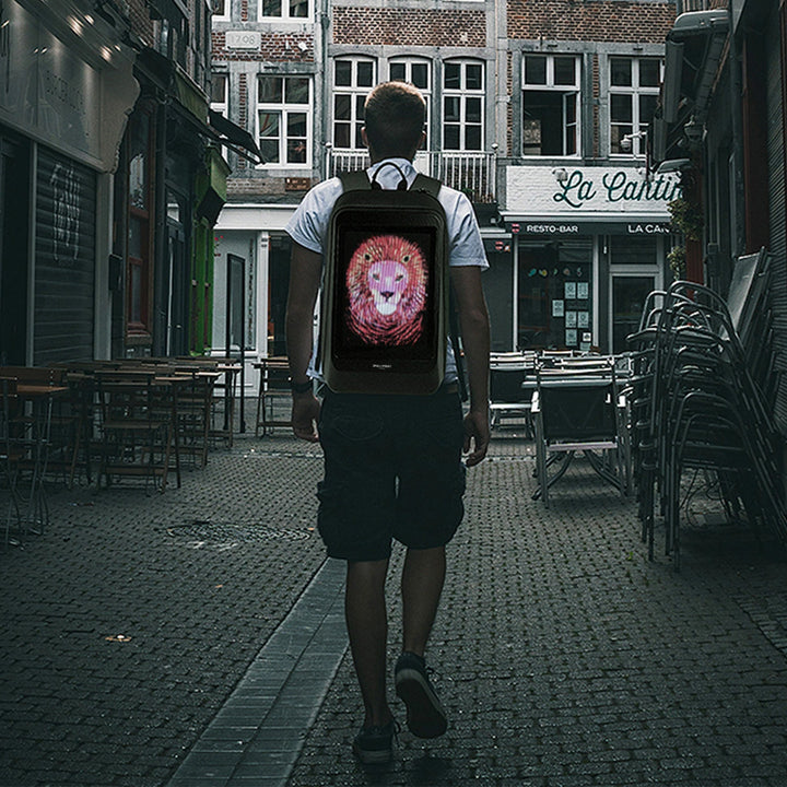 Man standing, showcasing the backpack on his back.