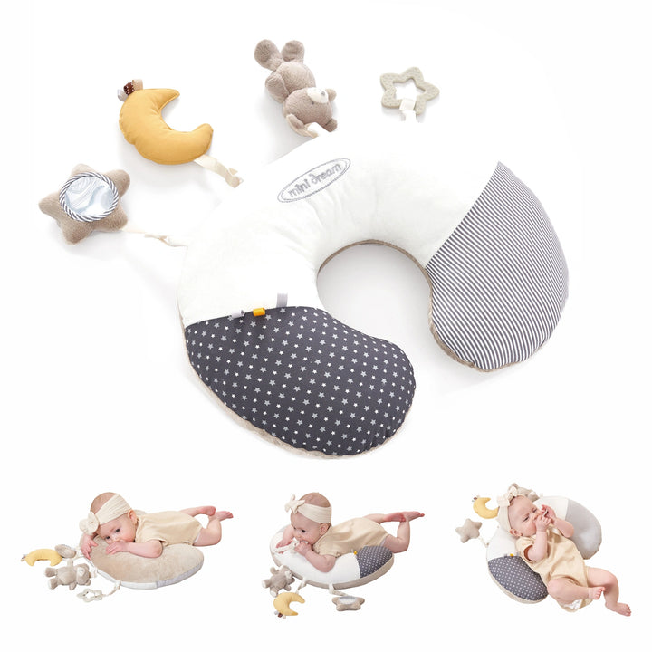 Tummy time pillow includes sensory-stimulating accessories: plush bunny, star-shaped silicone teether, and crescent moon.