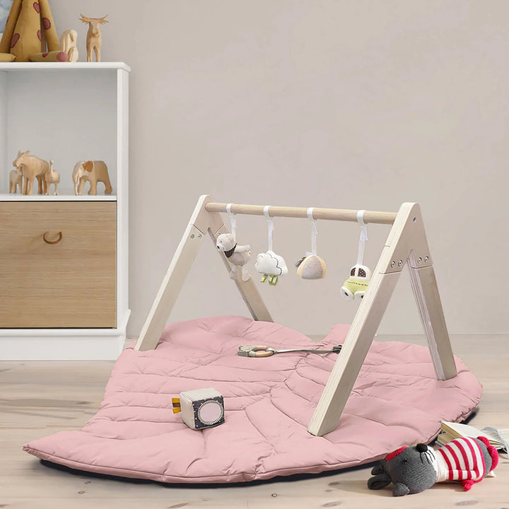 Wooden Baby Gym with a soft leaf playmat.