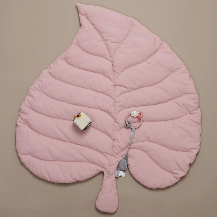 Wooden Baby Gym with a soft leaf playmat.