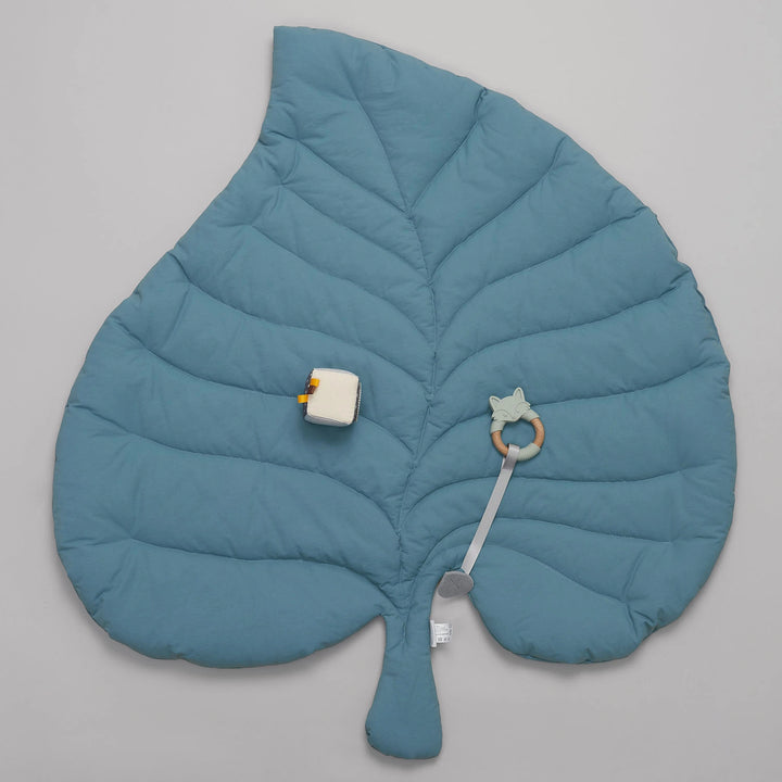 Wooden Baby Gym with a soft leaf playmat.