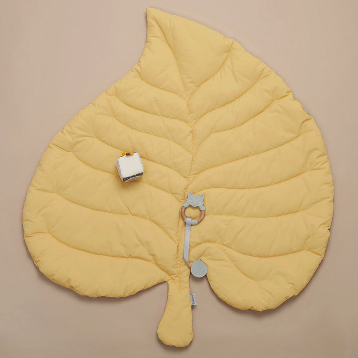 Wooden Baby Gym with a soft leaf playmat.