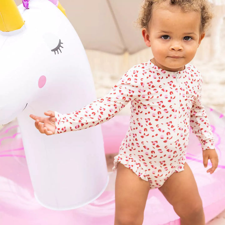 Side view of the inflatable unicorn swim ring, highlighting the detailed rainbow wings and mane.