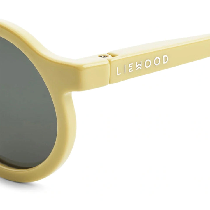 A close-up of the spring hinges on Liewood Darla sunglasses highlights their flexibility and durability.