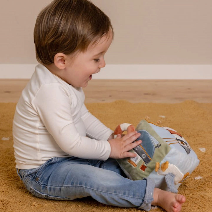 Each panel of the Baby Activity Cube features engaging textures and activities.