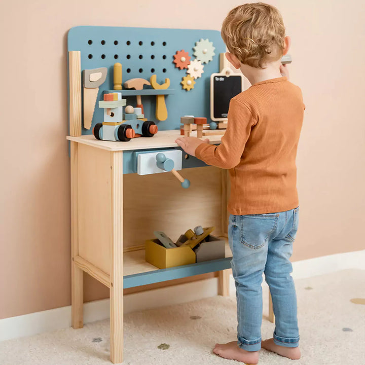 Colourful wooden work table with chalkboard, storage bins, and a vice, perfect for imaginative play.