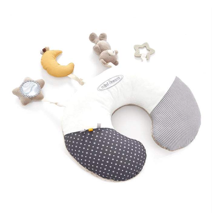 MiniDream tummy time pillow with nursery accessories and plush toys.