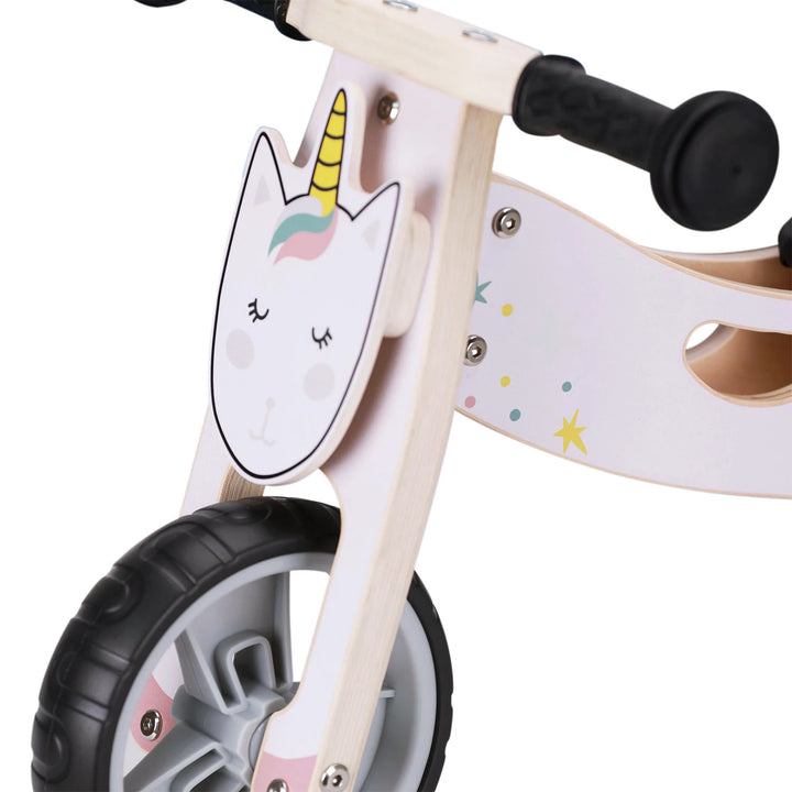 The unicorn balance bike features a cute unicorn face on its front.