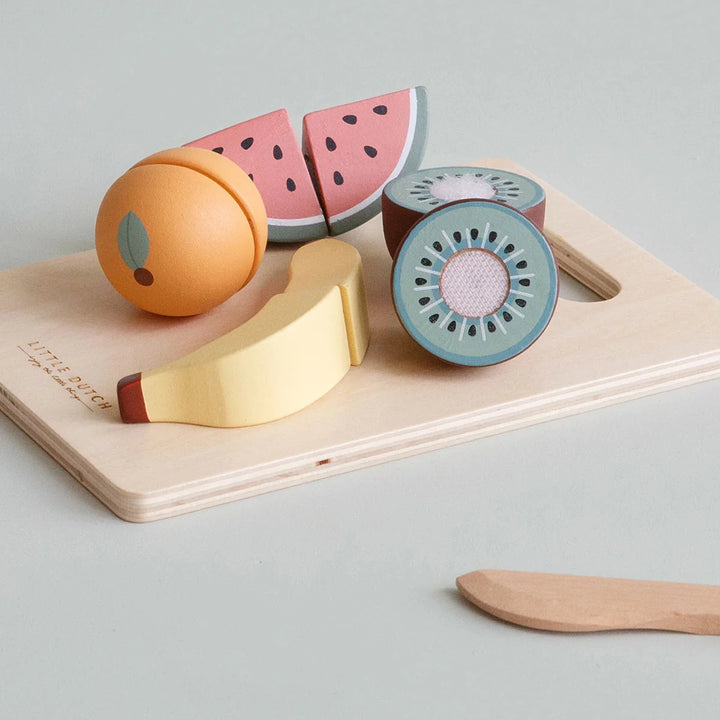 A close-up photo highlights the realistic details of a wooden orange toy, complete with textured peel and visible segments inside.